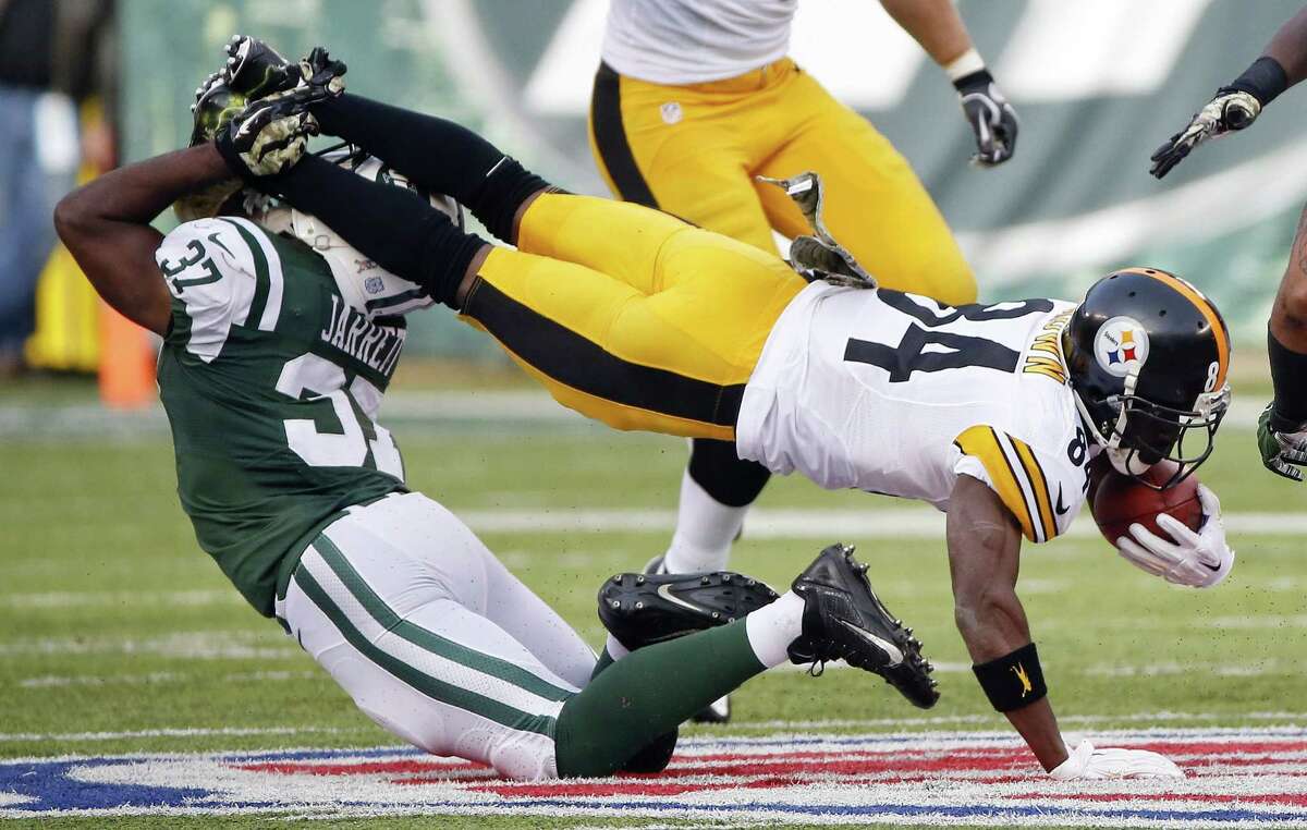 New York Jets free safety Jaiquawn Jarrett (37) tackles Pittsburgh Steelers' Antonio Brown (84) during the first half of an NFL football game Sunday, Nov. 9, 2014, in East Rutherford, N.J. (AP Photo/Kathy Willens)