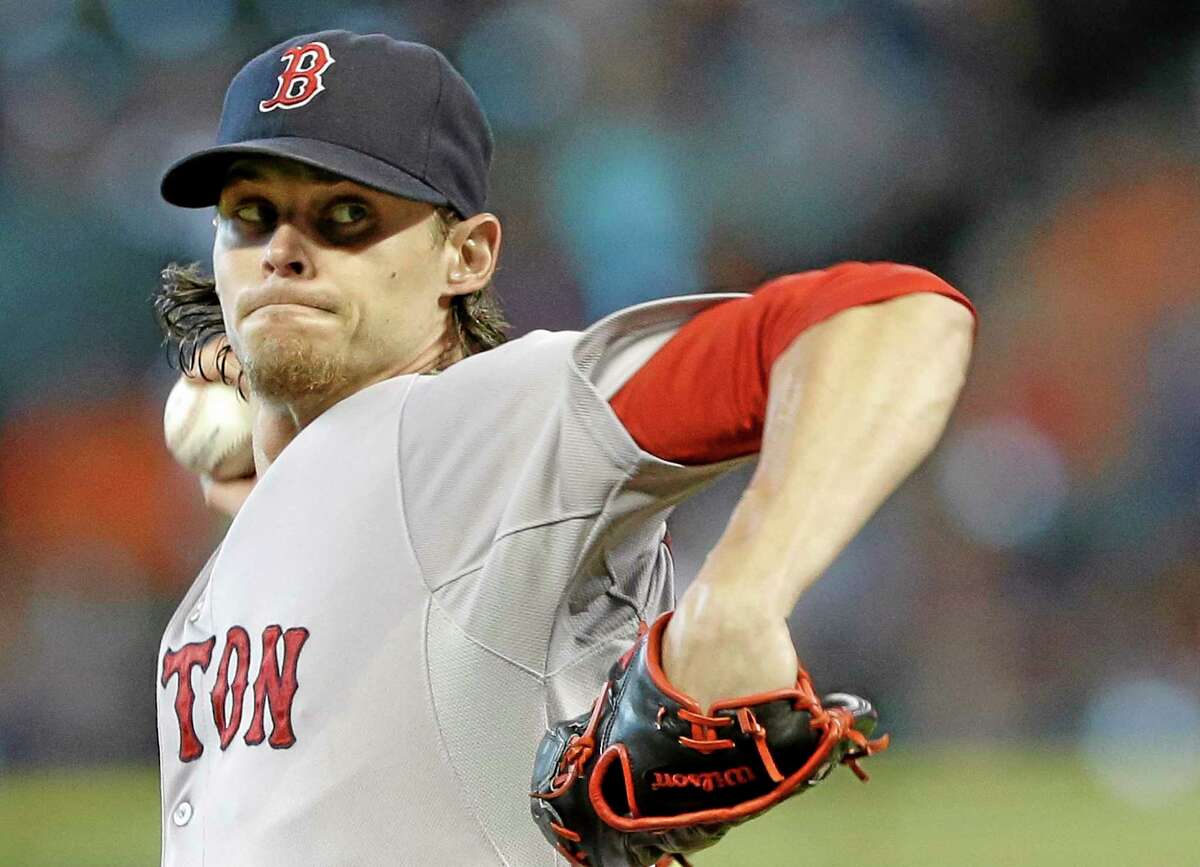 Clay Buchholz delivers a pitch against the Houston Astros in the first inning Sunday.