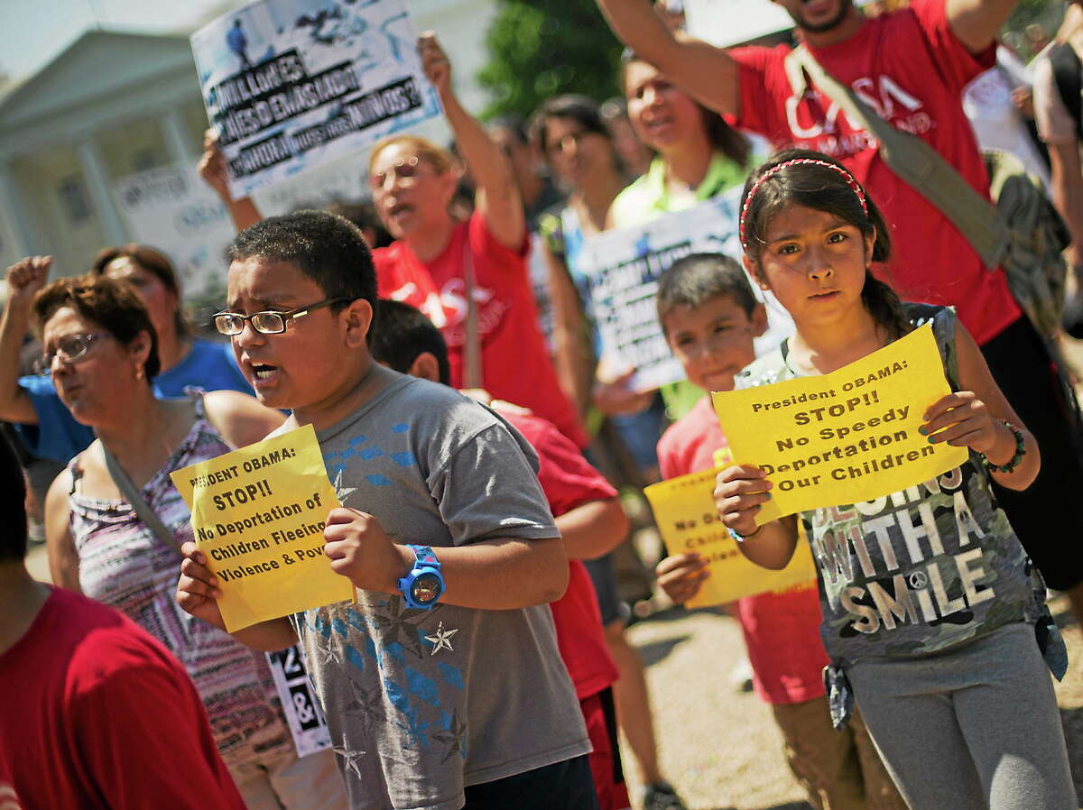 Alexandria Diaz, 9, from Baltimore, Md., joins her parents during a march in front of the White House in Washington on July 7, 2014, following a news conference of immigrant families and children’s advocates responding to the President Barack Obama’s response to the crisis of unaccompanied children and families illegally entering the U.S.