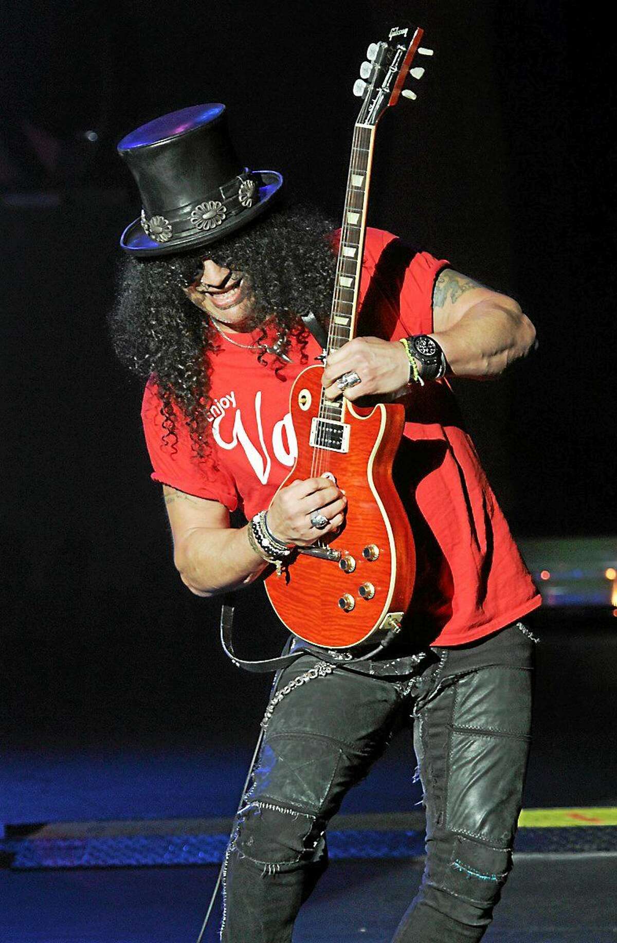 Photo by John Atashian Guitarist and songwriter Saul Hudson, better known by his stage name Slash is shown performing on stage during a recent concert appearance with his solo band.