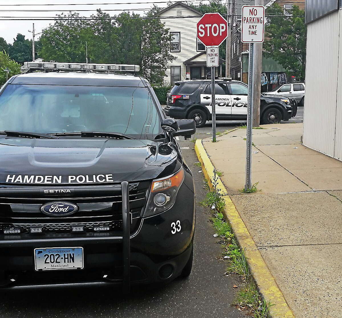 Police parked near the Abdul-Majid Karim Hasan Islamic Center on Sunday. The mosque’s security staff were reportedly preventing some members from entering without answering questions, but police reportedly did not try to stop anyone from praying. (Photo by Shahid Abdul-Karim -- New Haven Register)