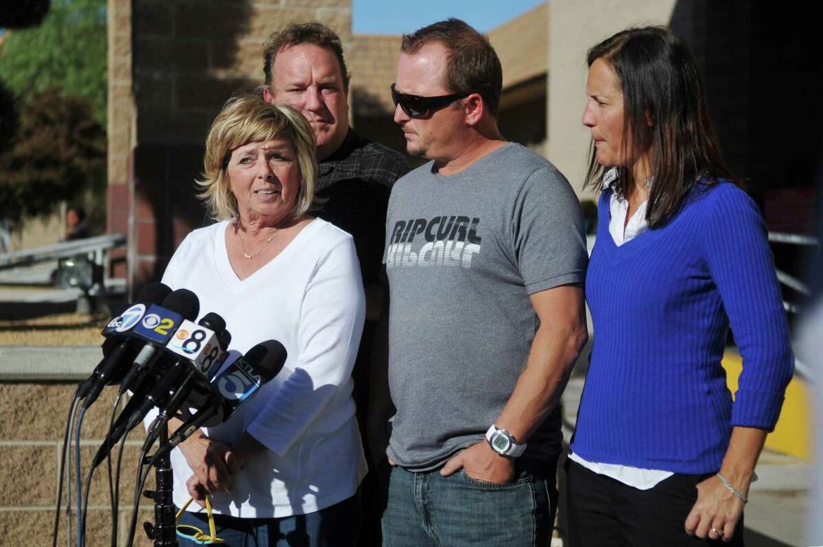 Joseph McStay's mother Susan McStay, left, brother Michael McStay, center, Michael's wife Erin , right, and family friend Gerrit Macey, talk with the media, Friday, Nov. 7, 2014, after seeing Charles "Chase" Merritt appear for a hearing at the Victorville Courthouse in Victorville, Calif. Merritt, 57, made a brief court appearance Friday on four counts of murder in the February 2010 deaths of Joseph McStay, 40, his wife, Summer, 43, and their sons, 4-year-old Gianni and 3-year-old Joseph. The family's remains were found last year buried in the desert. He did not enter a plea and was due back in court next week. (AP Photo/The Victor Valley Daily Press, David Pardo)