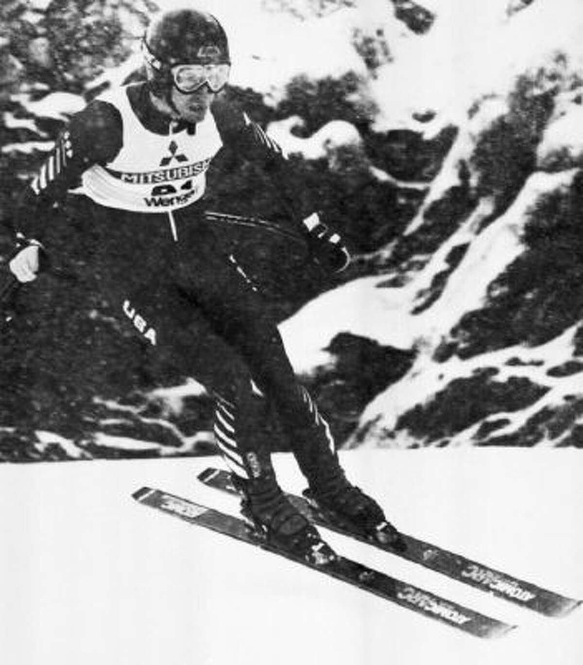 In this Sunday, Jan. 15, 1984 file photo, Bill Johnson of Van Nuys, Calif. makes his way down the Lauberhorn course in the World Cup Mens Downhill Race, Wengen, Switzerland.