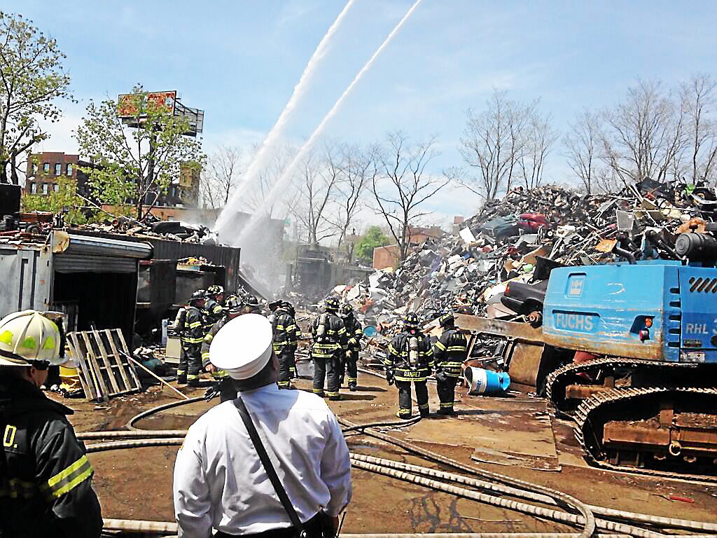 Crews battle fire at scrap metal yard in New Haven