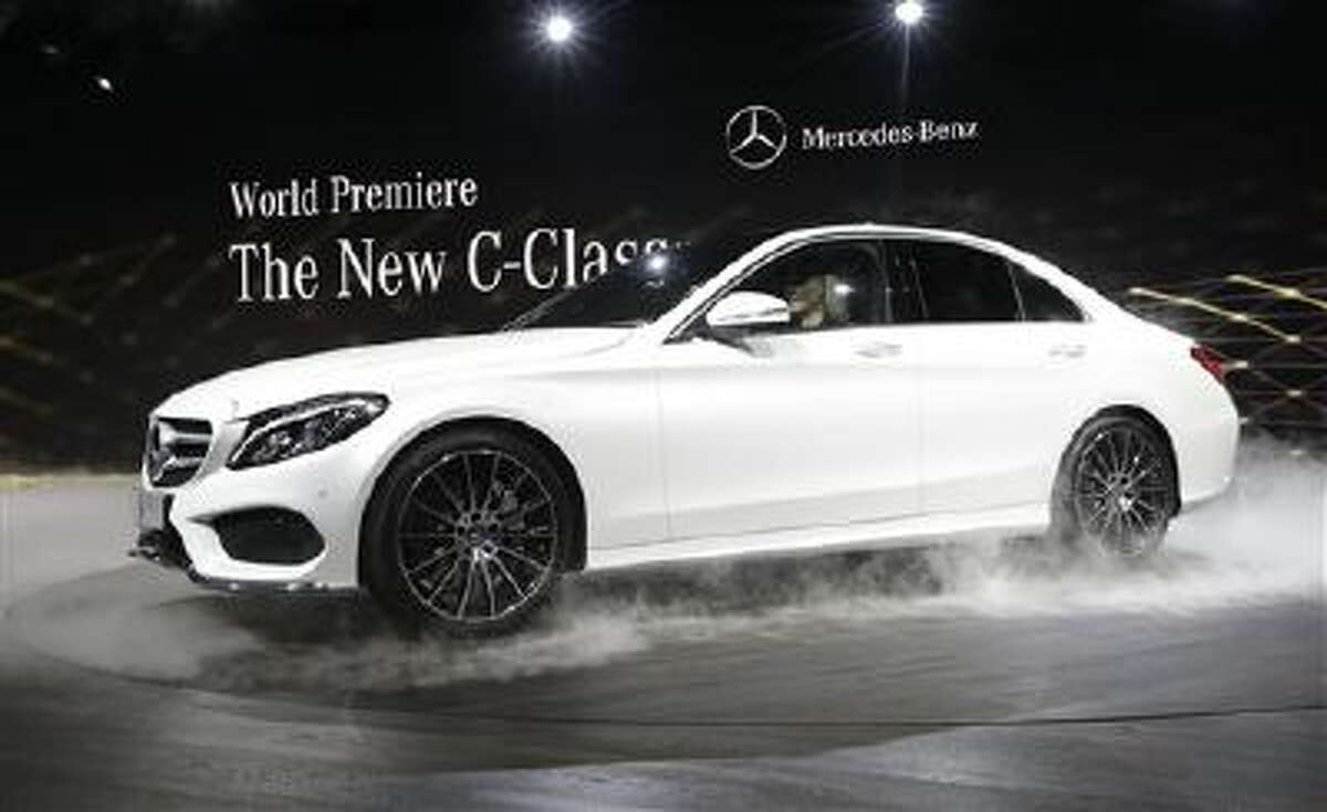 Mercedes Benz unveils the new C-Class car during a preview night for the North American International Auto Show in Detroit, Sunday, Jan. 12, 2014.