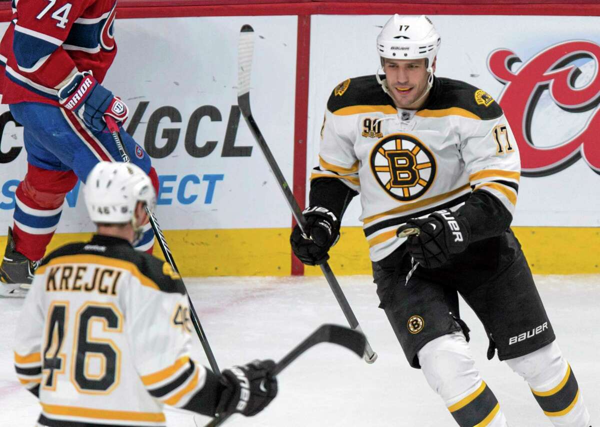 The Bruins’ Milan Lucic, right, celebrates his goal against the Canadiens with teammate David Krejci during the second period of Boston’s 4-1 win on Wednesday in Montreal.