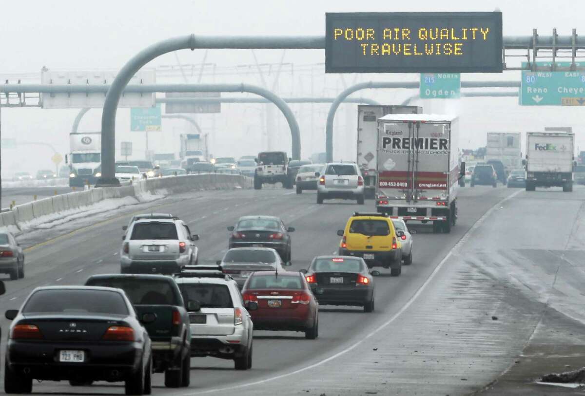 This Jan. 23, 2013, file photo, shows a poor air quality sign posted over a highway in Salt Lake City. A new government report released Jan. 13, 2014, says energy-related carbon dioxide pollution increased slightly in 2013 after declining for several years in a row.