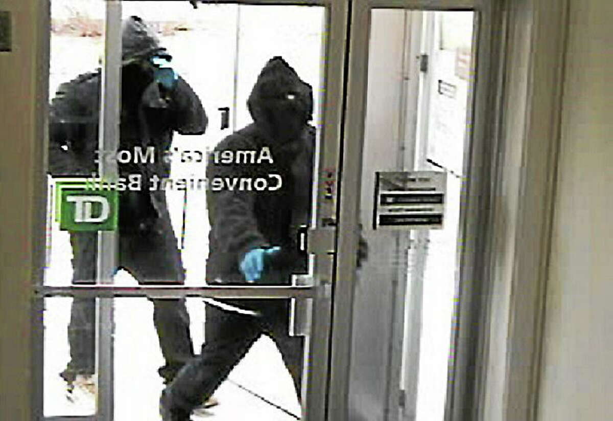 Security photo of the two alleged robbers entering TD Bank Wednesday. Photo courtesy of the Woodbridge Police Department.