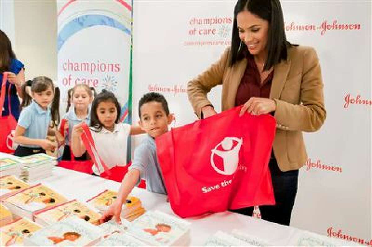 IMAGE DISTRIBUTED FOR JOHNSON & JOHNSON - Univision's Karla Martinez joins students from Hialeah Elementary School (Fla.) to launch the Johnson & Johnson "Champions of Care" program, on Thursday, March 6, 2014, in Hialeah, Fla. (Photo by Mitchell Zachs/Invision for Johnson & Johnson/AP Images)