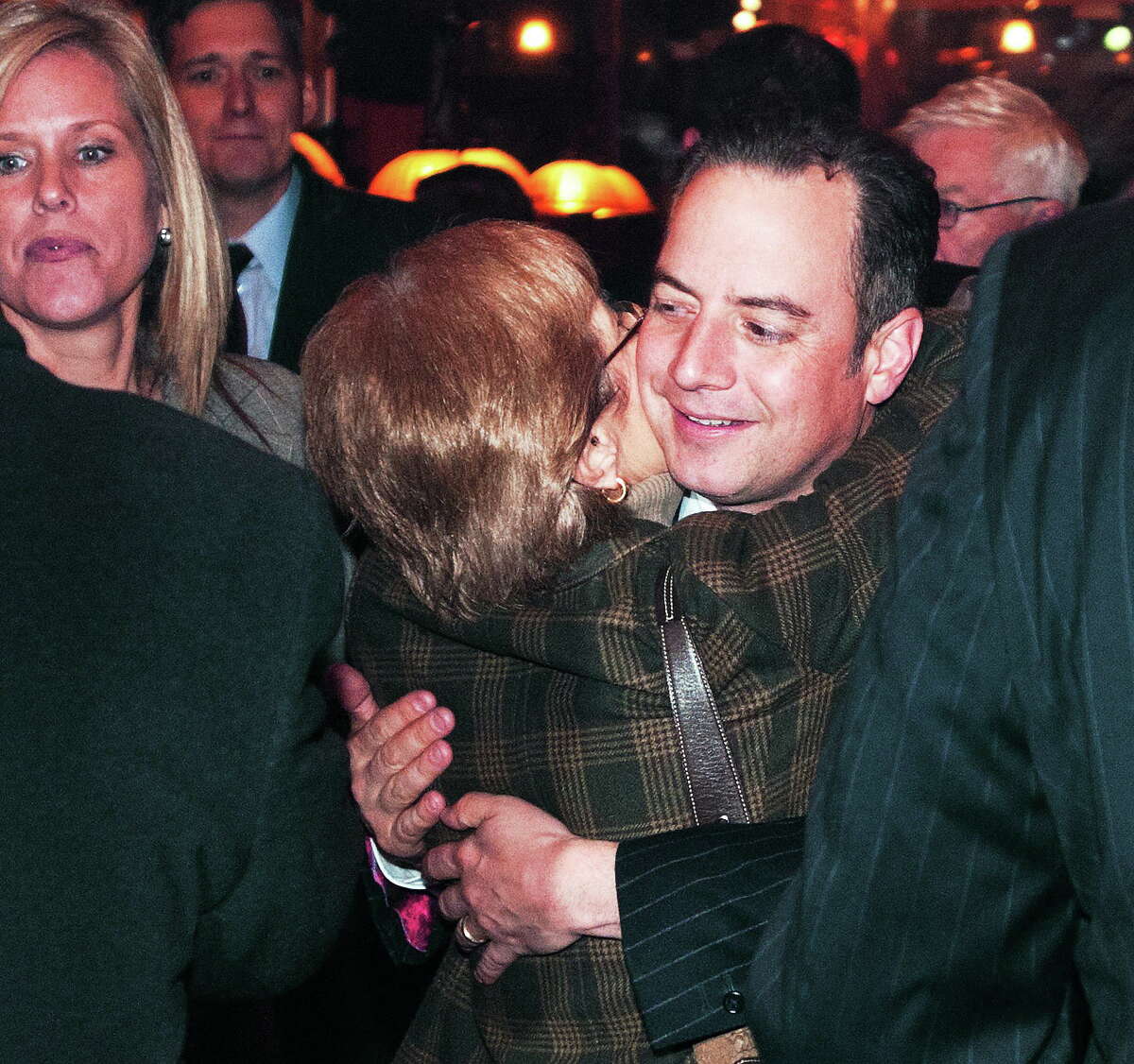 Peter Casolino — New Haven Register National Republican Party Chairman Reince Priebus gets a hug from CT RNC Committeewoman Patricia Longo at Thursday’s fundraiser inside the Owl Shop.