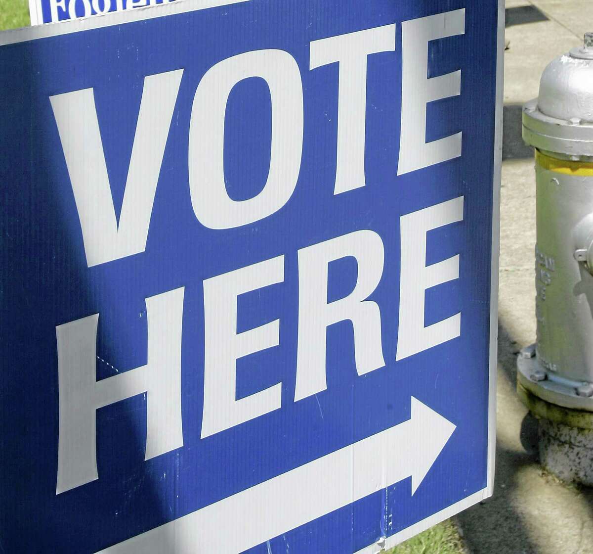 This May 3, 2010, file photo shows a “vote here” sign near a polling place open for early voting.