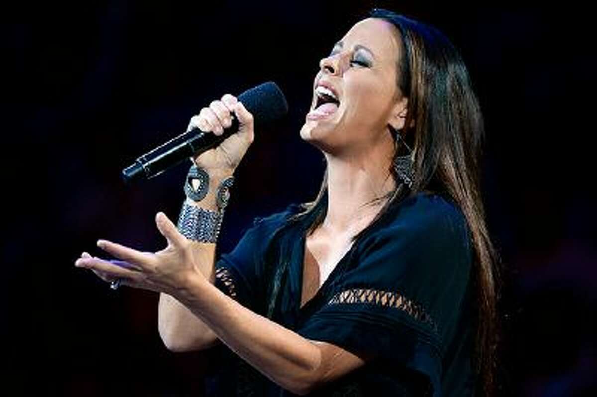 OKLAHOMA CITY, OK - JUNE 14: Singer Sara Evans performs the national anthem before the Miami Heat take on the Oklahoma City Thunder in Game Two of the 2012 NBA Finals at Chesapeake Energy Arena on June 14, 2012 in Oklahoma City, Oklahoma. NOTE TO USER: User expressly acknowledges and agrees that, by downloading and or using this photograph, User is consenting to the terms and conditions of the Getty Images License Agreement. (Photo by Ronald Martinez/Getty Images)