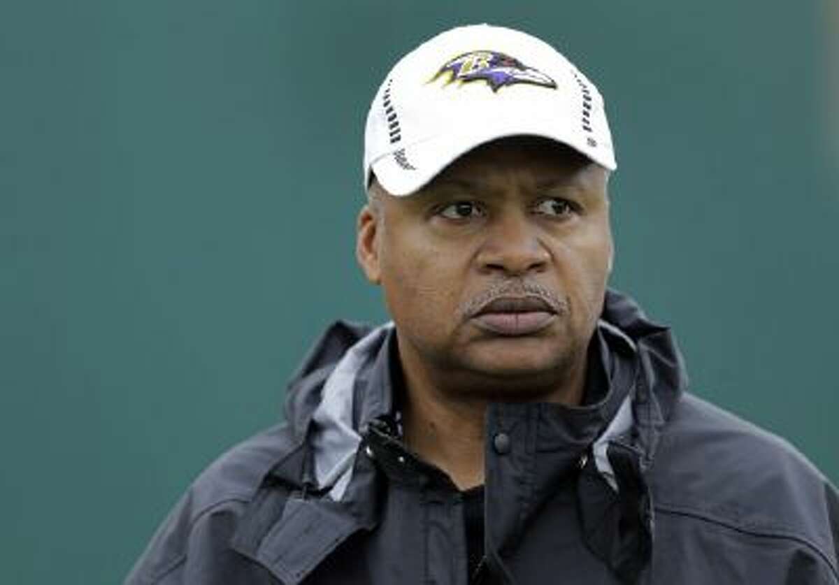 Baltimore Ravens offensive coordinator Jim Caldwell walks onto the field as his team warms up during an NFL Super Bowl XLVII football practice on Jan. 30, 2013, in New Orleans. The Ravens played the San Francisco 49ers in Super Bowl XLVII.