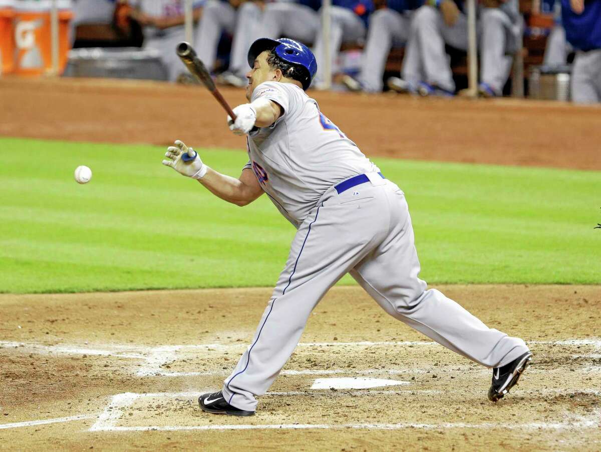 The Mets’ Bartolo Colon fouls the ball as he hits during the sixth inning of Tuesday’s game against the Miami Marlins, The Marlins won 3-0.