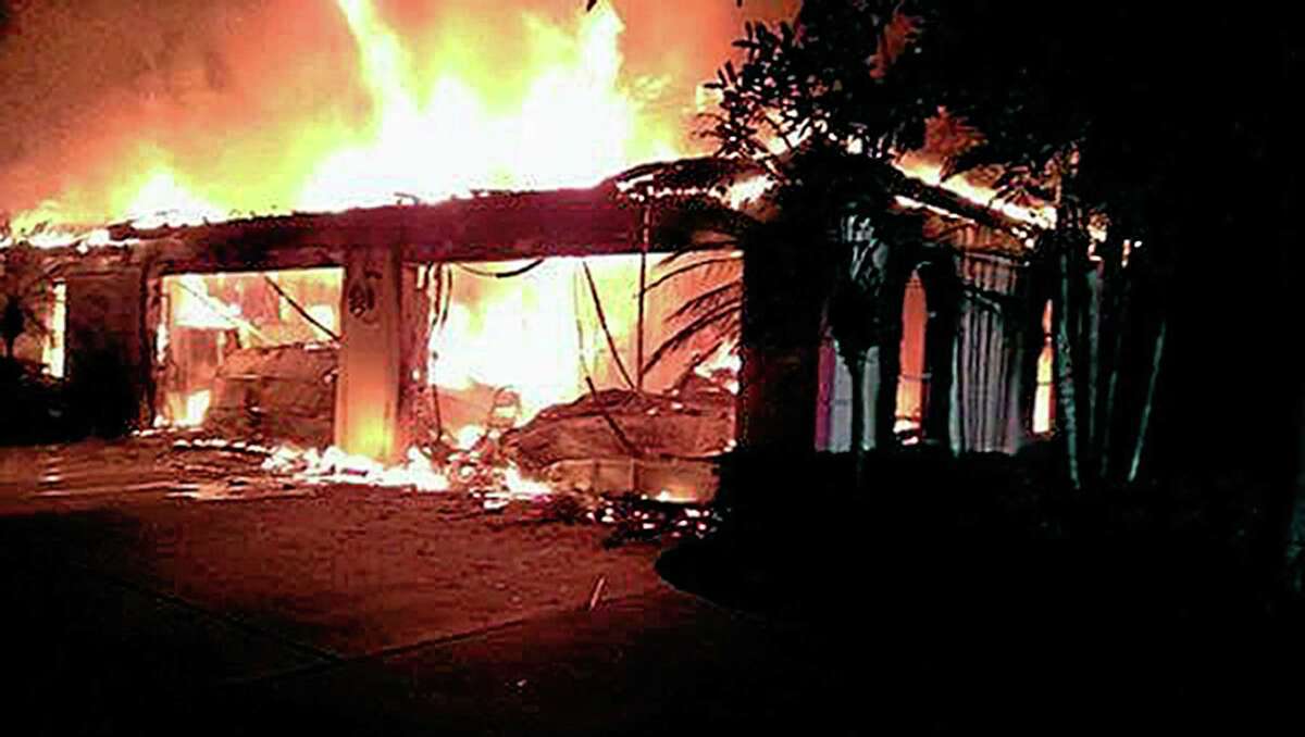 In this photo provided by the Hillsborough County Sheriff’s Office, flames destroy a mansion owned by former tennis star James Blake on Wednesday in a gated community in Tampa, Fla. Officials have confirmed four bodies have been found in the home. Hillsborough County Sheriff’s Spokeswoman Cristal Bermudez Nunez says neighbors have told detectives that Blake hasn’t lived in the house for a while and was renting it out.