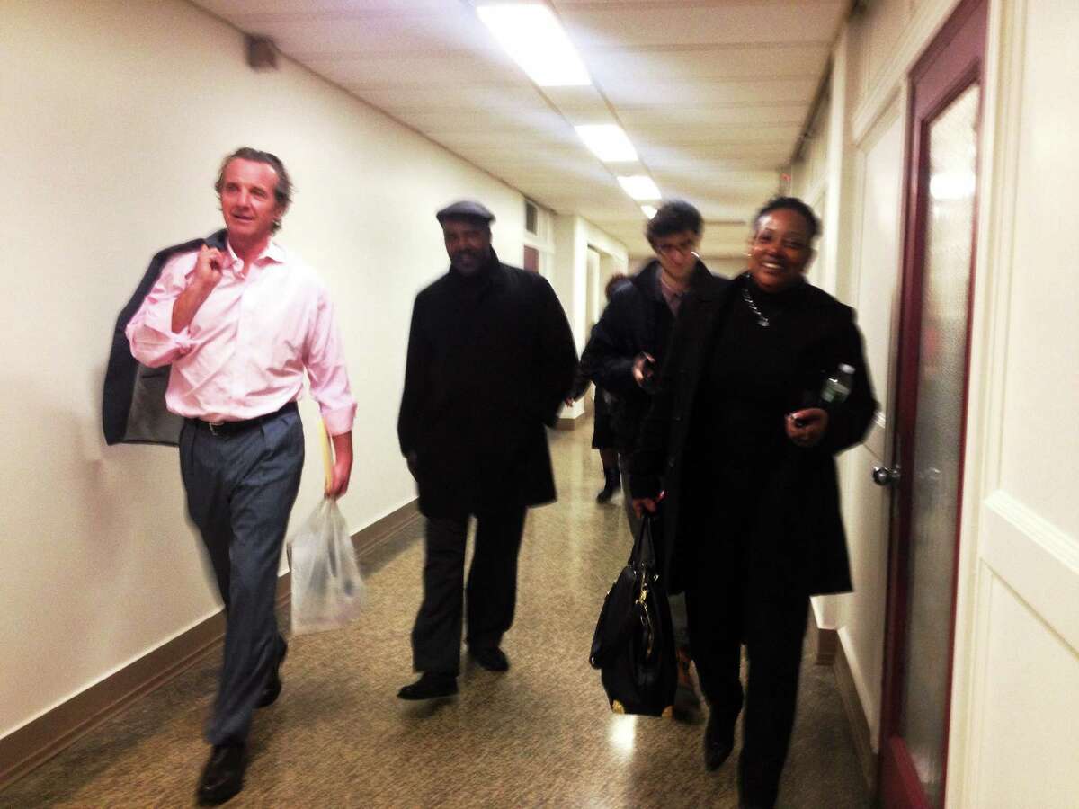 Members of the aldermanic People's Caucus walk up to the city clerk's office Tuesday.