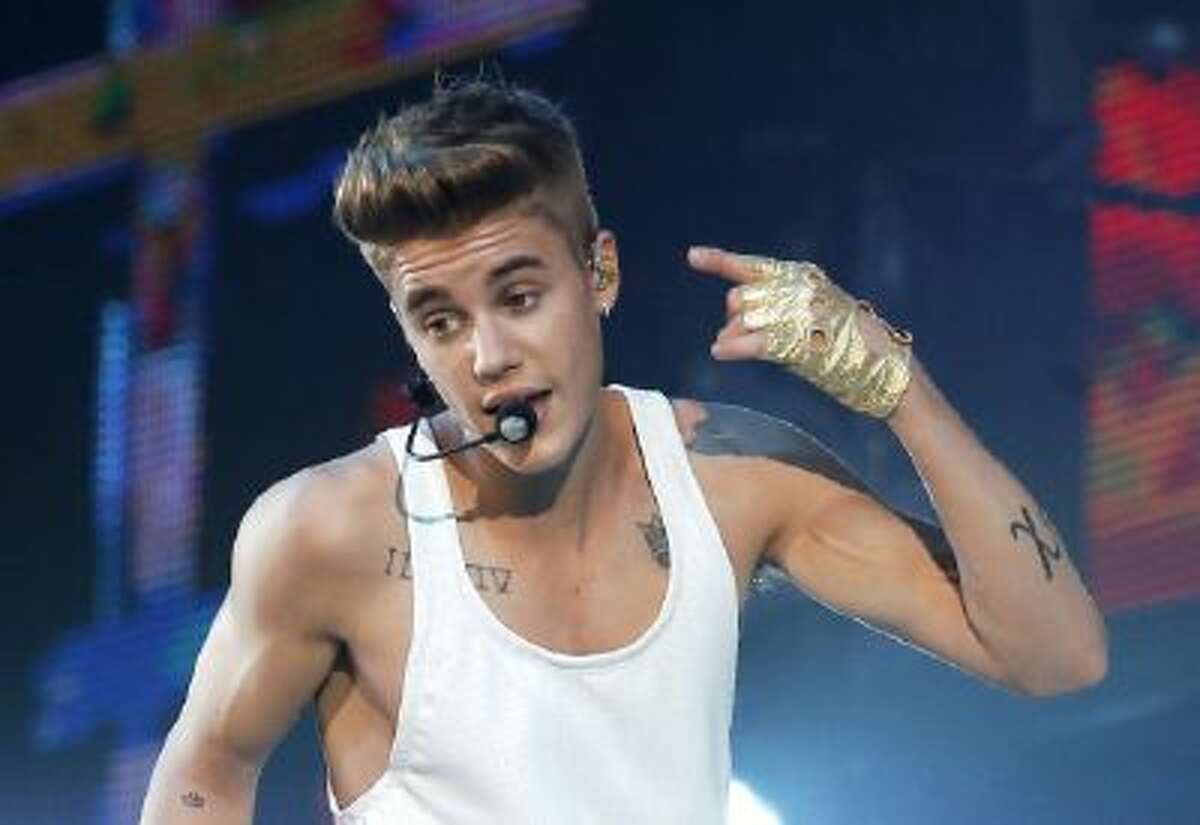 Justin Bieber performing during a concert in Paris.