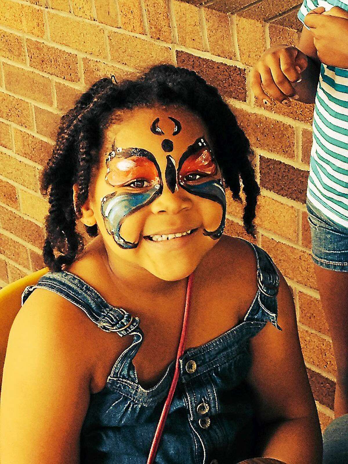 Arayia Tavares had her hair done at home, but her face painted at Transformerz Barbershop.