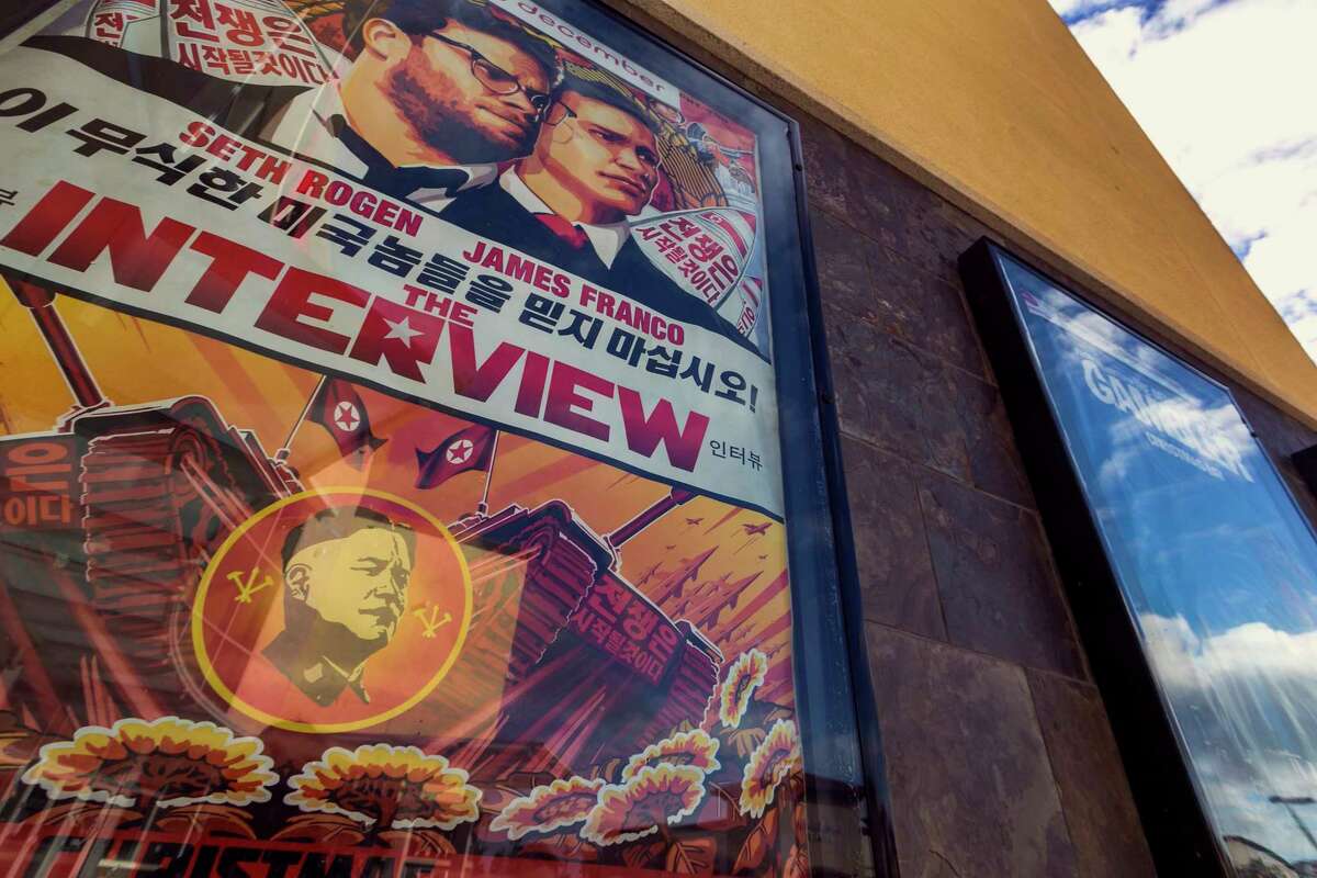 This Dec. 17, 2014 photo shows a movie poster for the movie “The Interview” on display outside the AMC Glendora 12 movie theater, in Glendora, Calif.