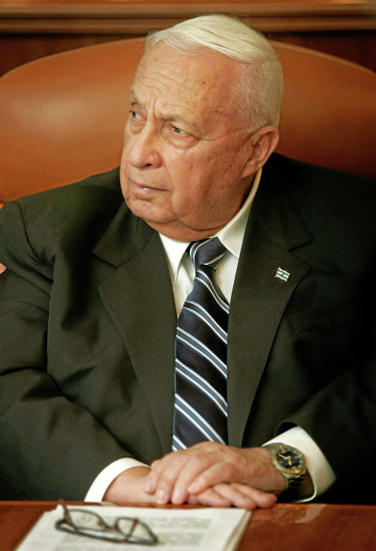 FILE - In this Dec. 12, 2005, photo file photo, Israeli Prime Minster Ariel Sharon attends a meeting at his office in Jerusalem. Sharon, the hard-charging Israeli general and prime minister who was admired and hated for his battlefield exploits and ambitions to reshape the Middle East, died Saturday, Jan. 11, 2014. He was 85. (AP Photo/Oded Balilty, File)