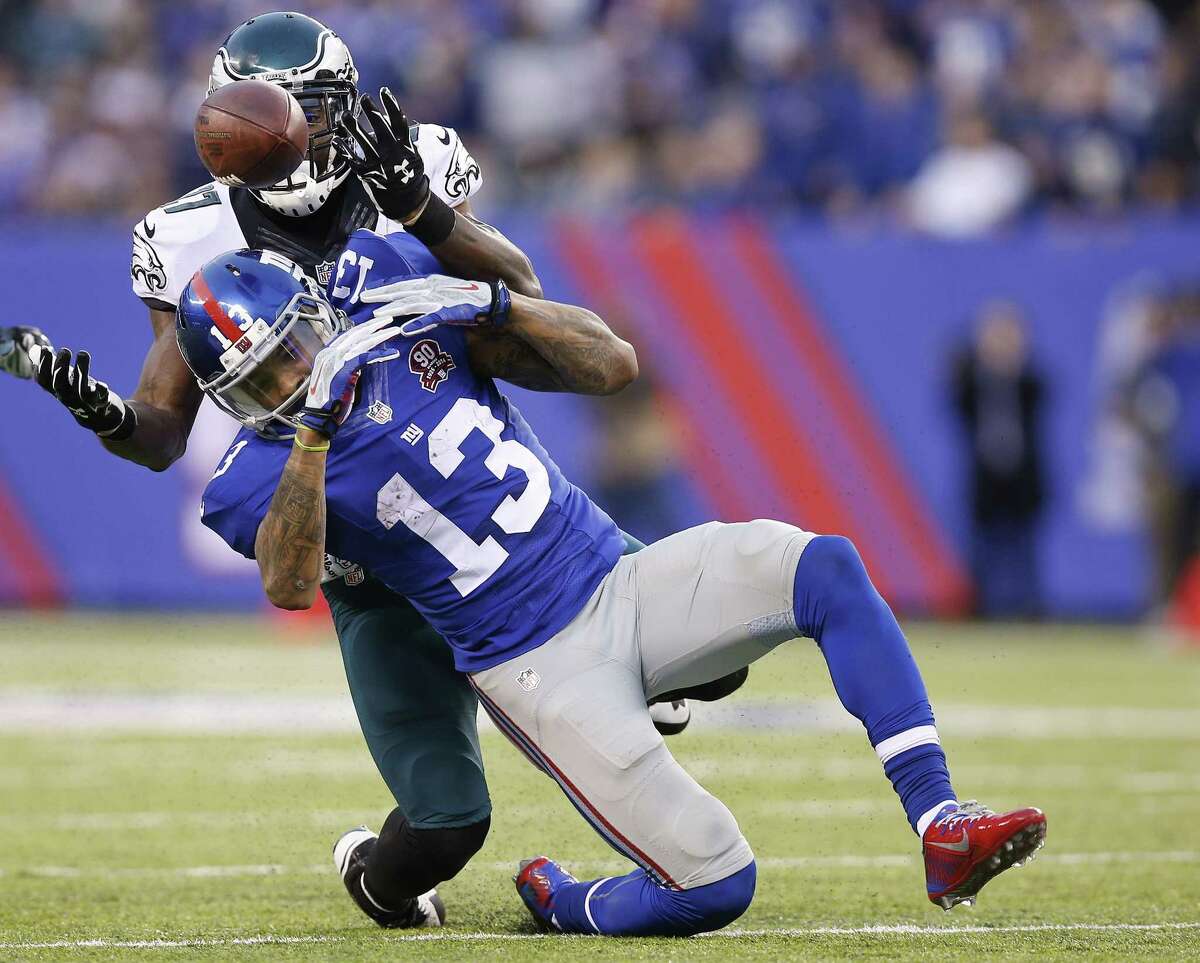The Eagles’ Malcolm Jenkins (27) breaks up a pass to the Giants’ Odell Beckham (13) during the second half Sunday.