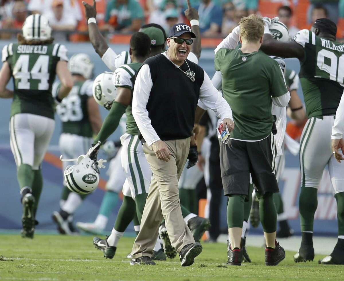 Jets head coach Rex Ryan celebrates a touchdown by tight end Jeff Cumberland late in the second half Sunday.