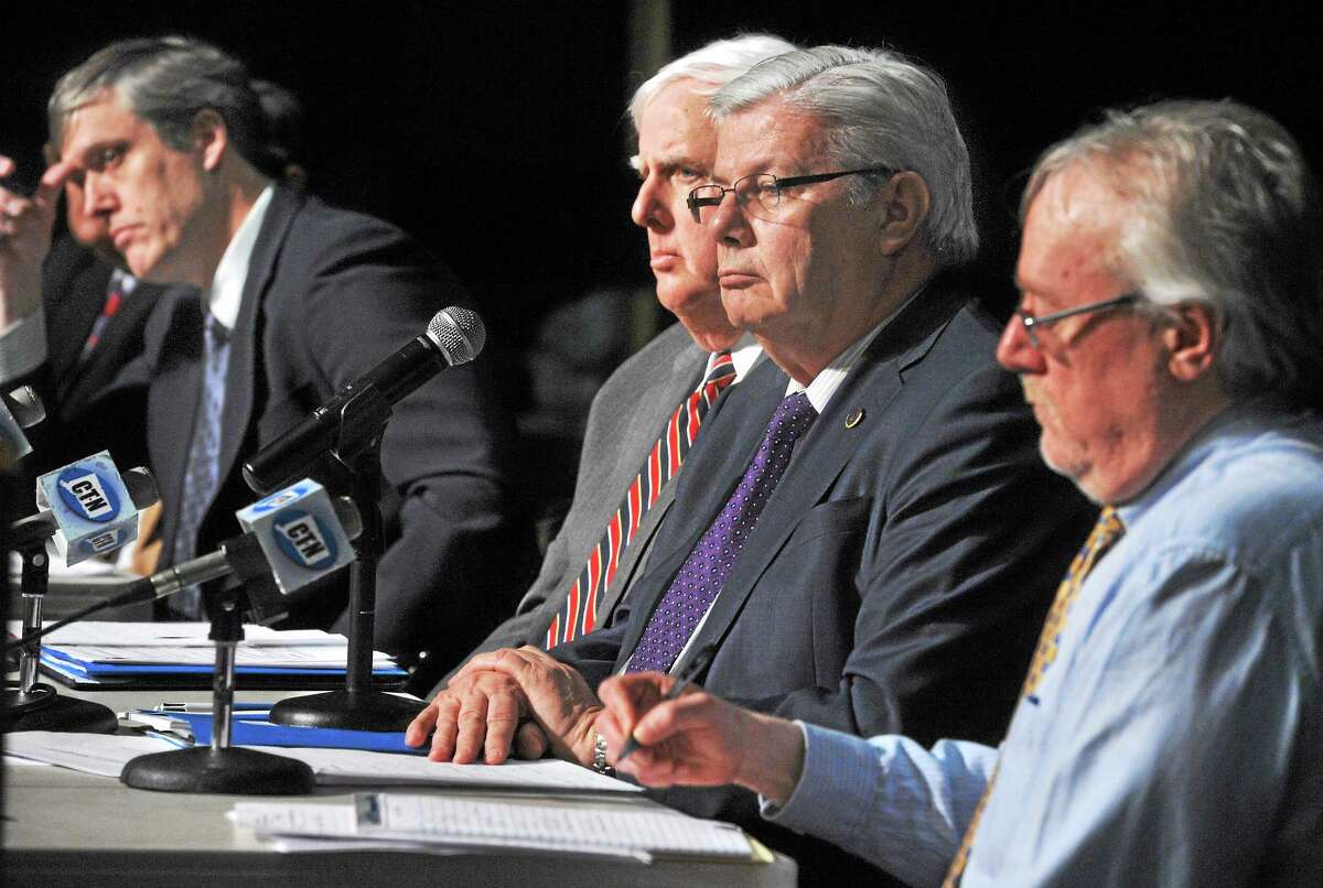 State Public Utility Regulatory Authority members, from left, George Denning, Chairman Arthur House, Vice-Chairman Jack Betkoski III, and Frank Augeri Jr. listen during a hearing Thursday in Hamden regarding United Illuminating’s tree-trimming plan.