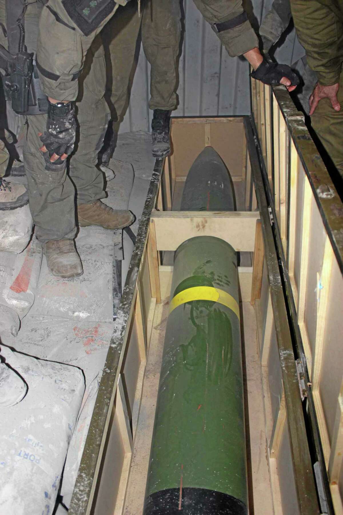 This photo released by the Israel Defense Forces shows a missile on an intercepted ship in the Red Sea Wednesday, March 5, 2014. Israeli naval forces raided a ship deep in the Red Sea early Wednesday and seized dozens of advanced rockets from Iran destined for Palestinian militants in Gaza, the military said. (AP Photo/IDF)
