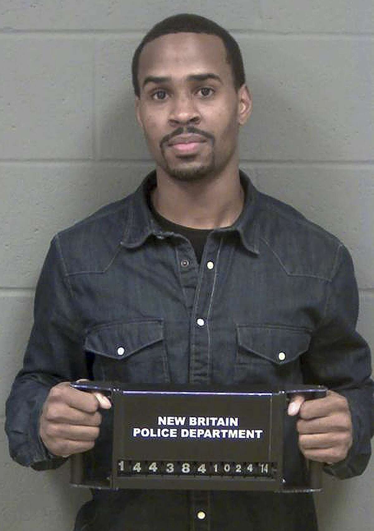 In a photo provided by the New Britain, Conn., Police, Central Connecticut basketball player Kyle Vinales poses for his booking photo after being arrested by New Britain Police Friday, Oct. 24, 2014, when his girlfriend accused him of striking her while the two were fighting. Vinales is charged with third-degree assault and disorderly conduct.