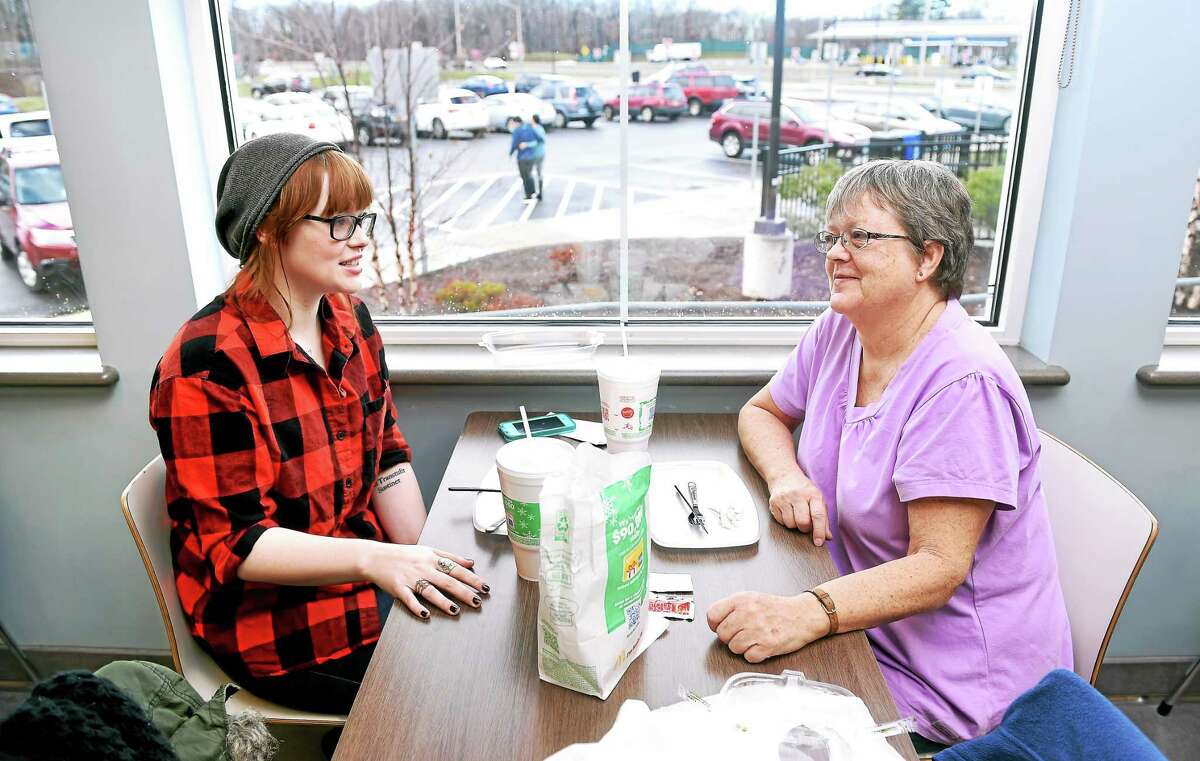 Cati Pishal (left) of New York has breakfast with her mother, Cathie Gunther of Milford at the Connecticut Service Plaza on I--95 northbound in Milford Christmas morning December 25, 2014. Breakfast at this rest stop is an annual tradition for the two and was only interrupted when the rest stop was under construction.