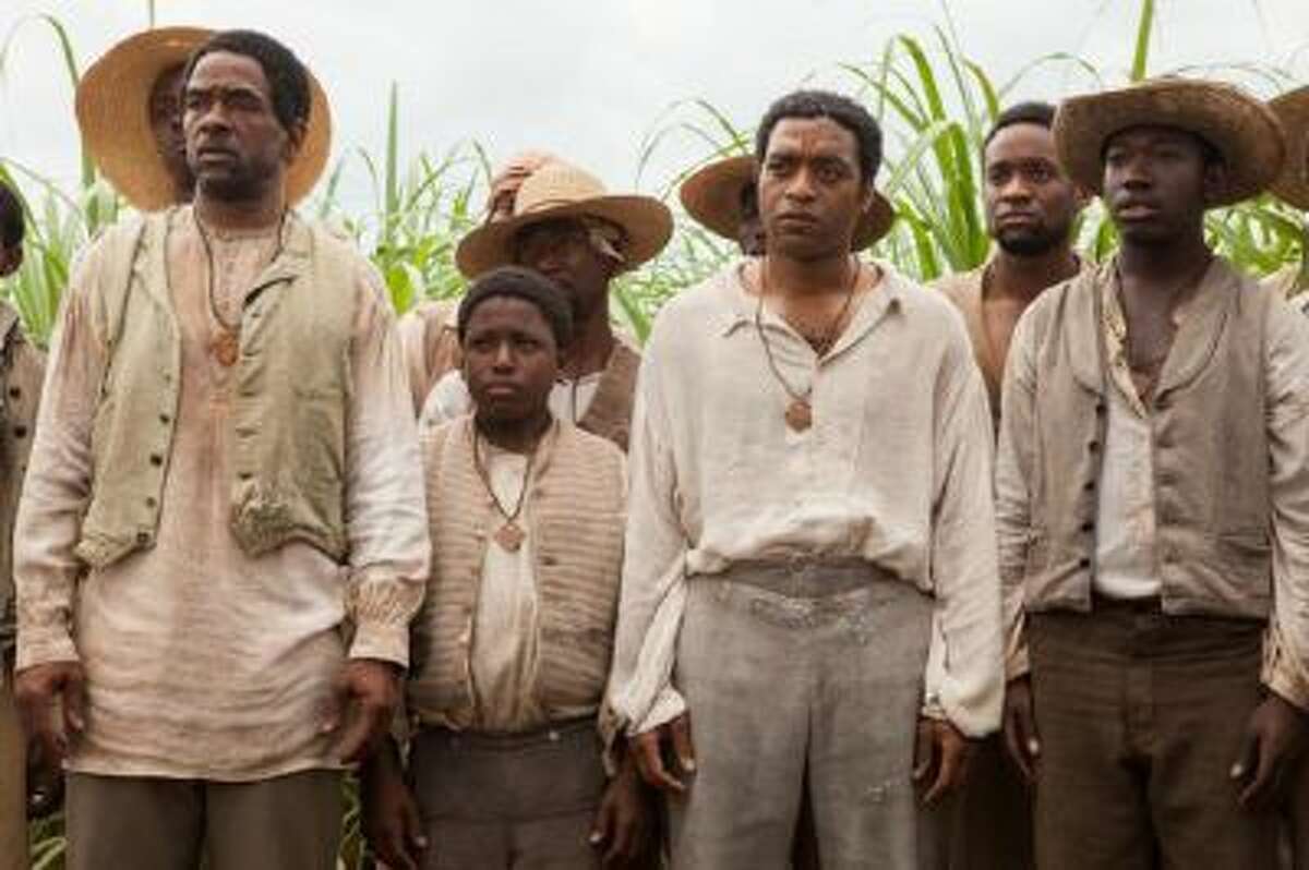 Chiwetel Ejiofor as Solomon Northup, third from right, in "12 Years A Slave."
