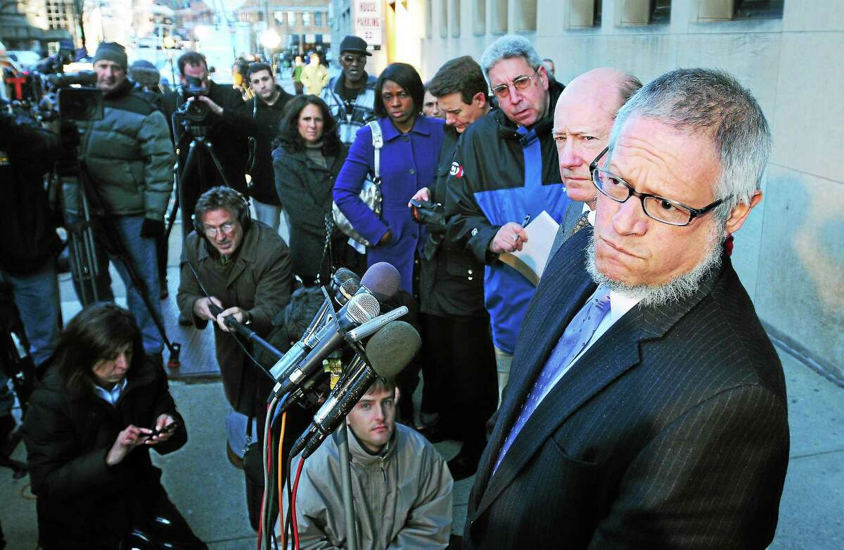 Steven Hayes’ defense attorneys Patrick Culligan, right, and Thomas Ullmann, far right, speak to media in front of Superior Court in New Haven after Hayes was officially sentenced to death Dec. 2, 2010.