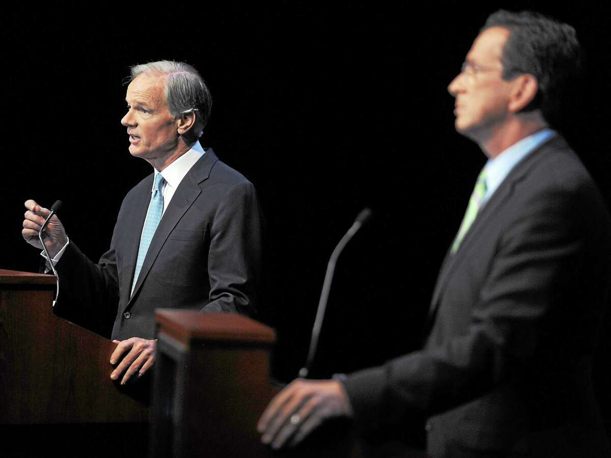 In a file photo, Republican Tom Foley, left, faces Democrat Dannel Malloy in a gubernatorial debate held at the Garde Arts Center in New London in 2010. A rematch of that race may be in the works, according to a recent Quinnipiac Poll.