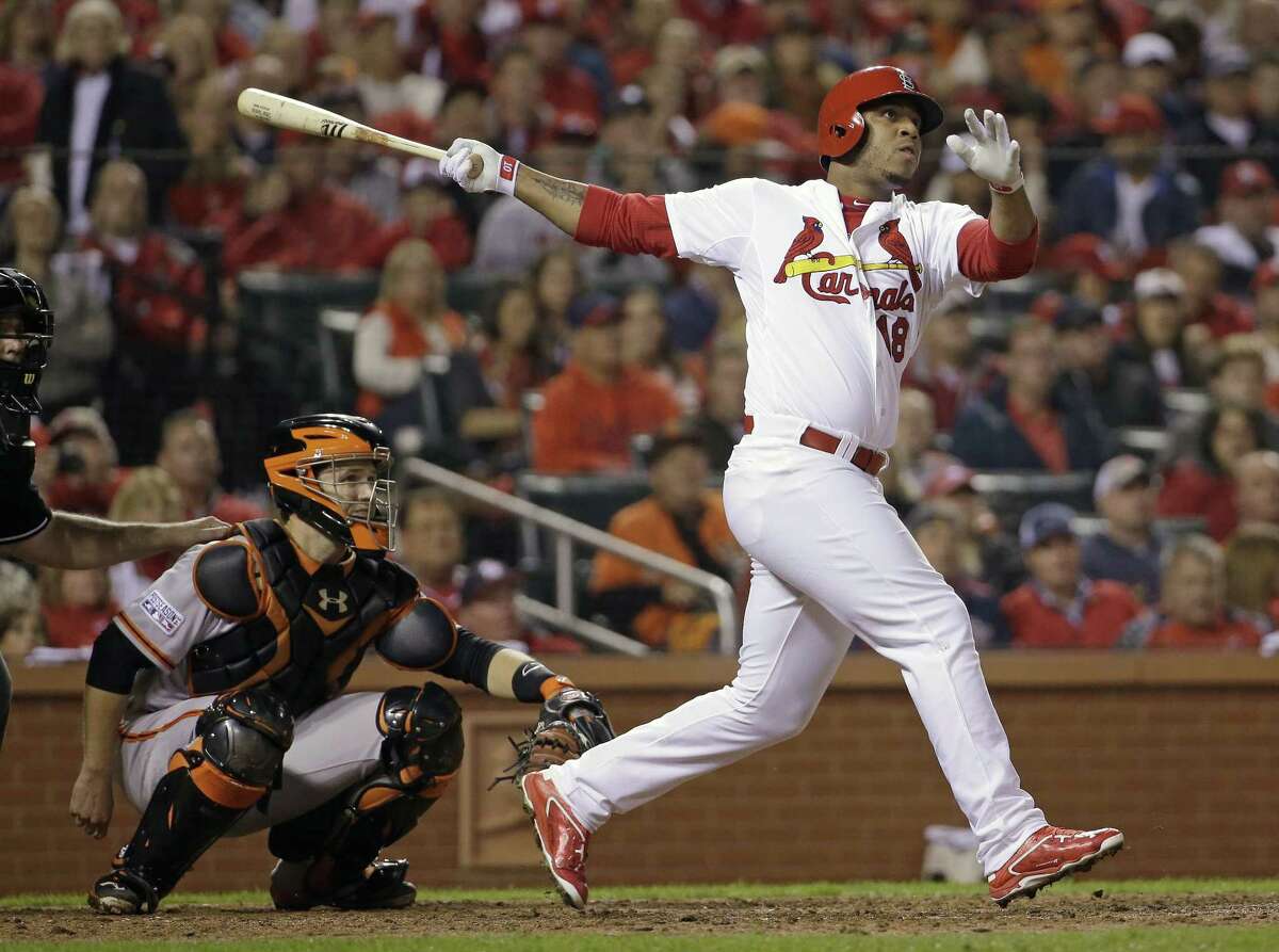 This Oct. 12, 2014 file photo shows St. Louis Cardinals’ Oscar Taveras hitting a home run during the seventh inning of Game 2 of the NLCS against the Giants.