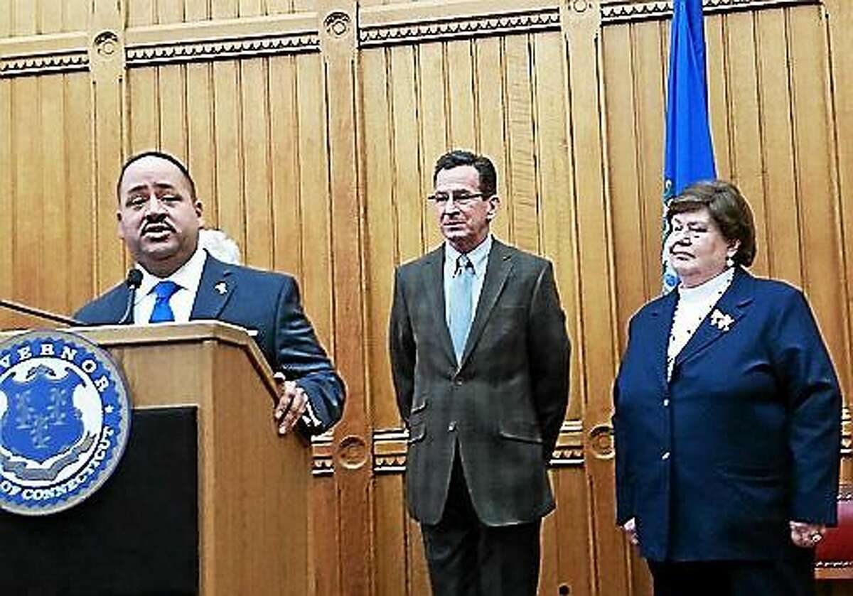 State Sen. Andres Ayala, left, speaks at a press conference Monday. Gov. Dannel P. Malloy, center, nominated Ayala to head the Department of Motor Vehicles, replacing its current commissioner Melody Currey, right.