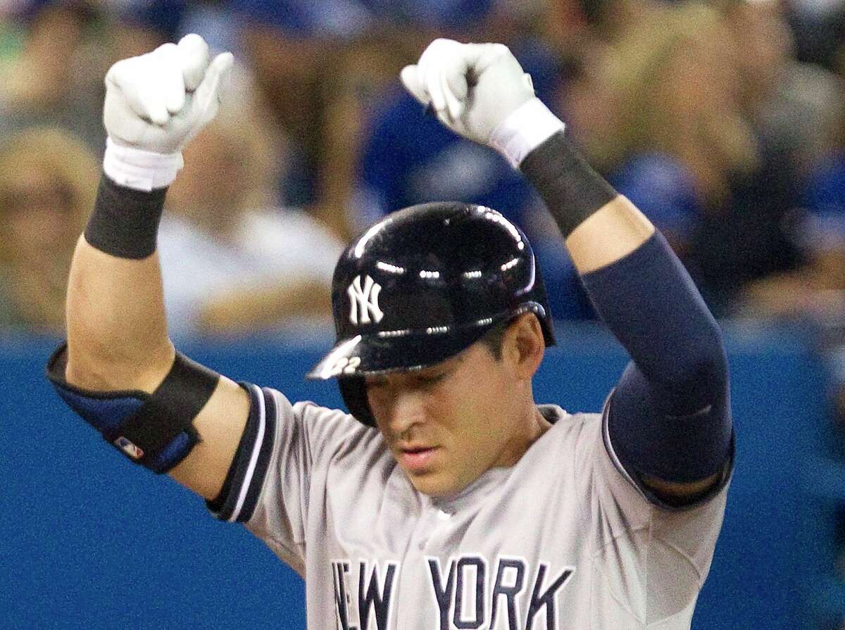 The Yankees’ Jacoby Ellsbury reacts at home plate after hitting a two-run home run against the Blue Jays during the seventh inning of New York’s 6-3 win on Friday in Toronto.