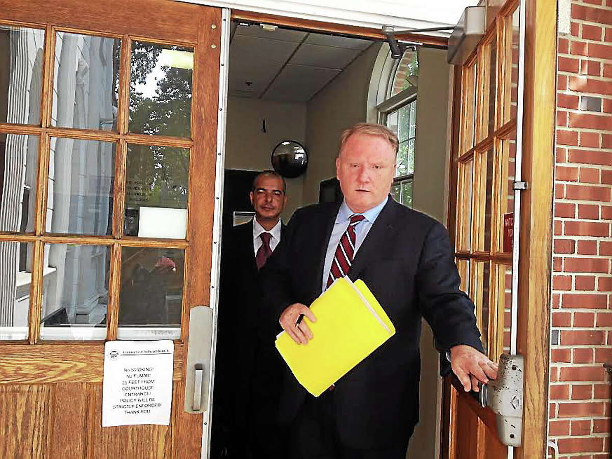 Dardian Celaj’s attorney, Stephan Seeger, leaves Superior Court in Milford after his client was a no-show Aug. 1. Celaj was taken into custody Thursday.