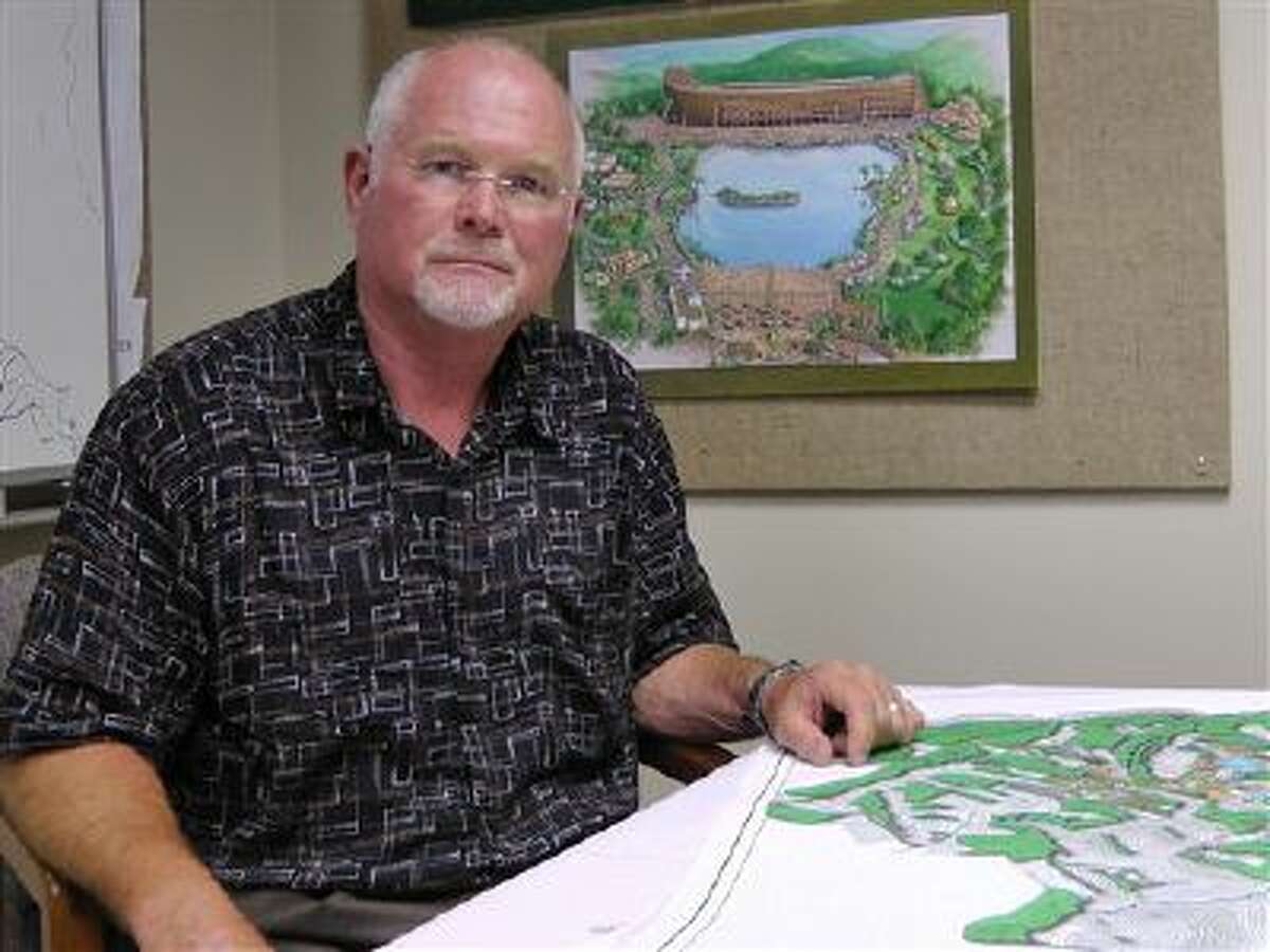 In this photo taken July 7, 2011, Mike Zovath, co-founder of Answers in Genesis ministries, poses for photos at the Ark Encounter headquarters in Hebron, Ky. The ark will be the centerpiece of a proposed $170 million religious theme park that has been approved for $40 million in taxpayer-funded incentives, upsetting activists who think public tax dollars should not be used to fund a religious theme park.