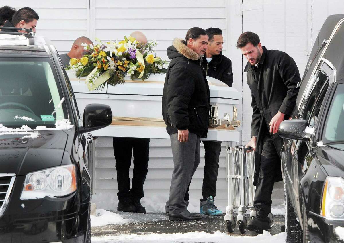 The casket of homicide victim Javier Martinez, 18, leaves Iglesia Jehova mi Roca in Hamden Friday morning after his funeral.