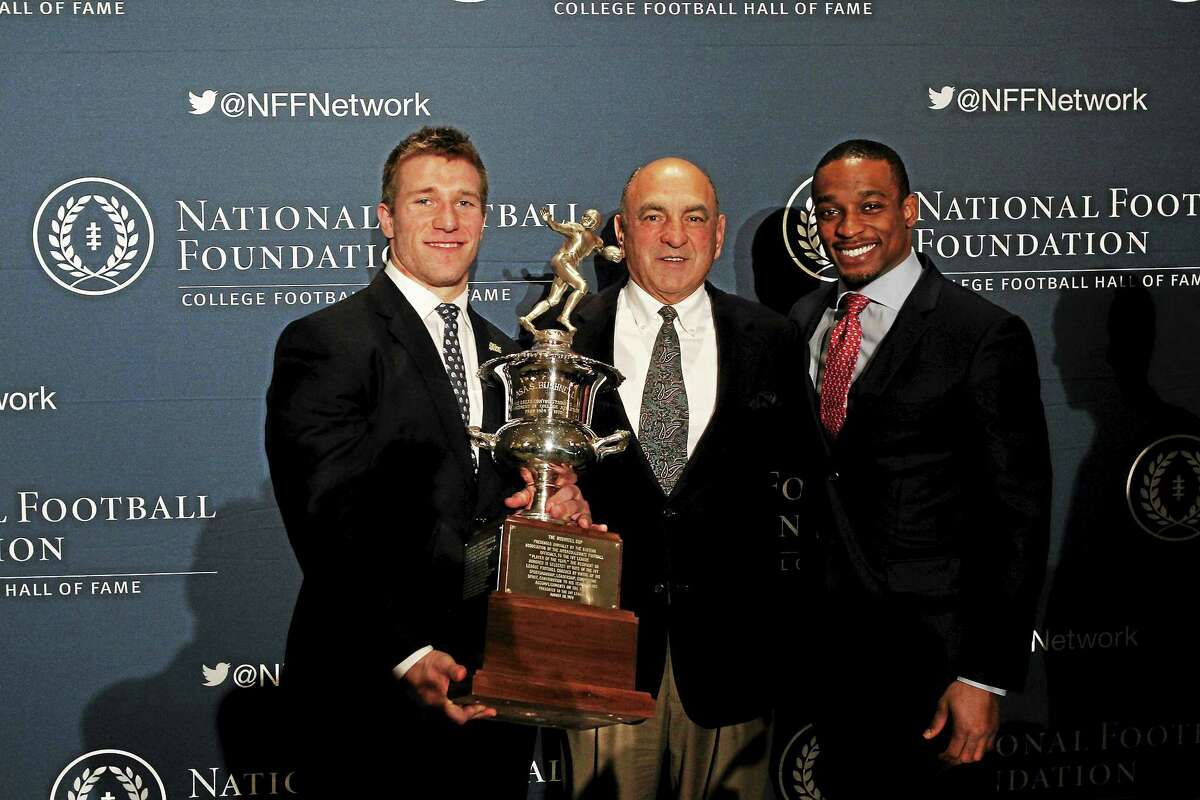 Mike McLaughlin Photography Yale's Tyler Varga, the Ivy League offensive player of the year, flanked by running backs coach Larry Ciotti and former Yale running back Mike McLeod, the last Bulldog to win the award, in 2007.