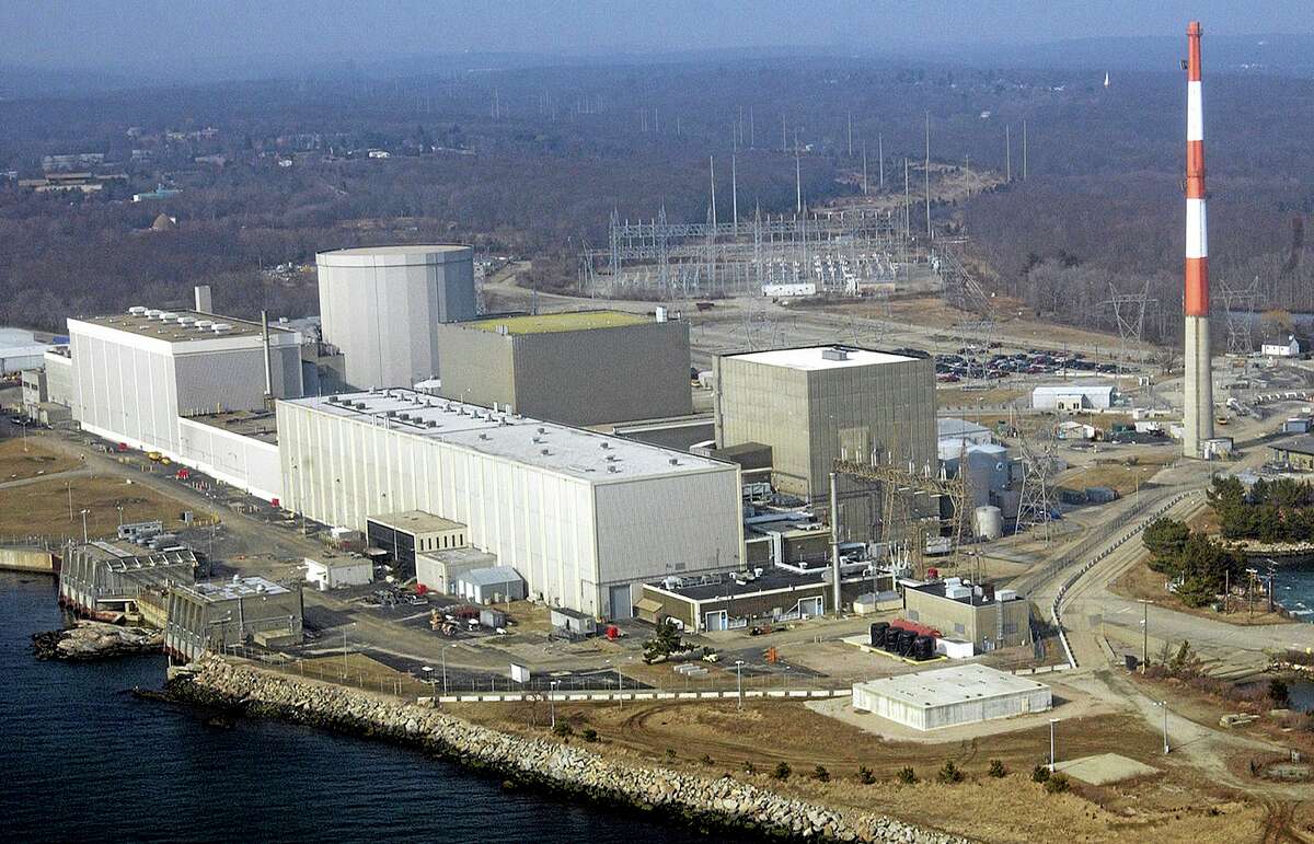 FILE - This March 18, 2003 aerial file photo shows the Millstone nuclear power facility in Waterford, Conn. Connecticut officials on Thursday, May 2, 2013 authorized the Millstone nuclear plant to significantly expand nuclear waste storage capacity from 19 cask storage units now to 135 by 2045. (AP Photo/Steve Miller, File)