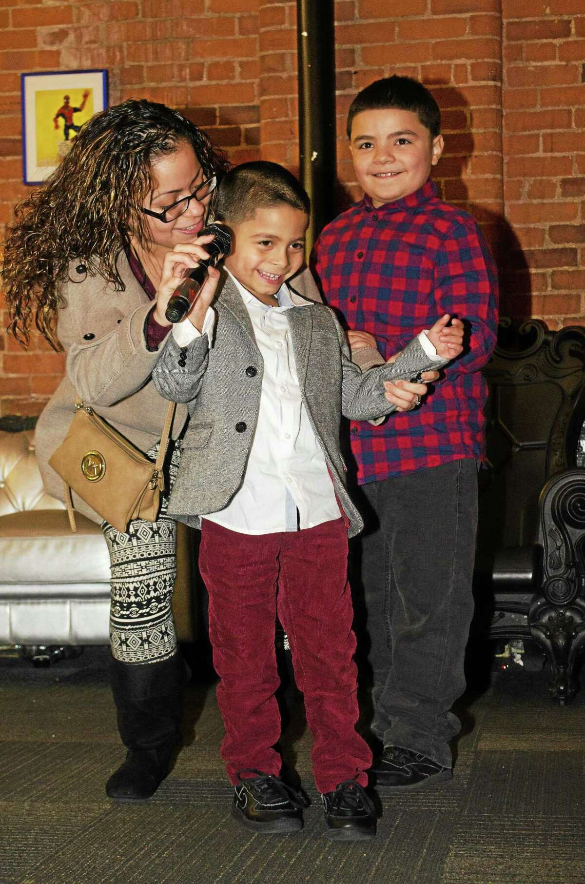 Adrian Laureano accompanied by his mother, Jasmine Gonzalez, and his brother, Josue Alvarez.