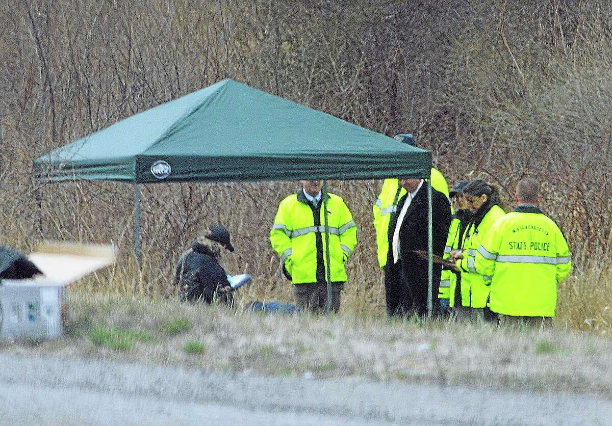 Massachusetts State Police stand along Interstate 190 where police said a child’s body was found Friday near Sterling, Mass. Worcester County District Attorney Joseph Early Jr., said the body has not been positively identified as Jeremiah Oliver, of Fitchburg, but that the height and weight of the body was consistent with Oliver’s size. Jeremiah Oliver was last seen by relatives in September 2013 but wasn’t reported missing until December. His mother Elsa Oliver and her boyfriend Alberto Sierra are both charged in the case.