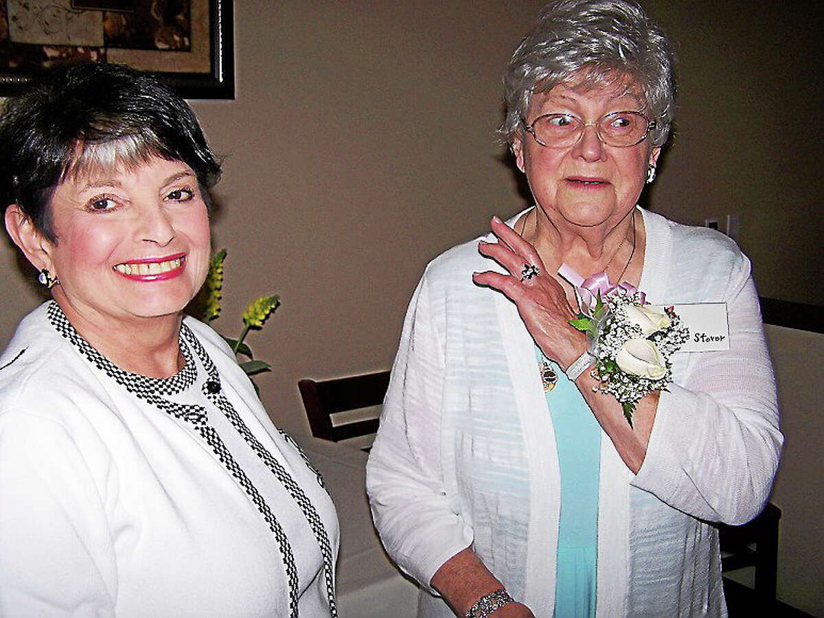 Founding member Lois Stover shows her wrist corsage to Lynda O’Donnel at the 60th anniversary celebration of North Haven Garden Club recently at Bellini’s restaurant. Stover's husband, Stuart Stover; son, Dwight Stover; and daughter, Caroline Cody with her husband, Elden Cody, were special guests. Scholarships were awarded to Brianna Brockett, who will be attending the University of Vermont, and Gabrielle Longobardi, who will be attending the University of Hartford. First Selectman Michael J. Freda, Federated Garden Clubs of Connecticut President Jacqueline Connell, and past members of the Junior Garden Club also attended.