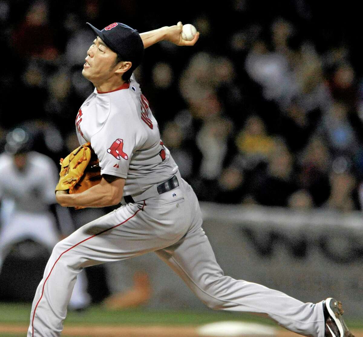 Boston Red Sox closer Koji Uehara delivers a pitch in a 3-1 win over the White Sox.