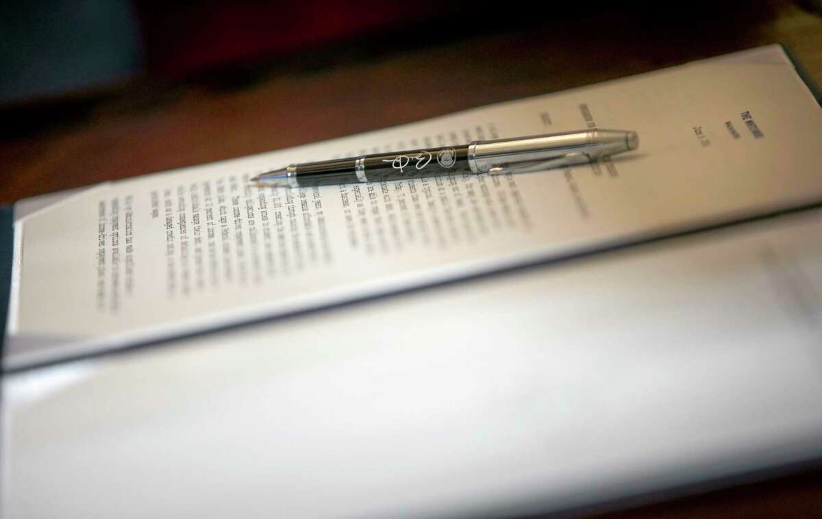 Close up the pen that President Barack Obama used to sign a Presidential Memorandum on reducing the burden of student loan debt, Monday, June 9, 2014 in East Room of the White House in Washington. The president said the rising costs of college have left America's middle class feeling trapped. He says no hard-working youngster in America should be priced out of a higher education. Obama signed a presidential memorandum he says could help an additional 5 million borrowers.(AP Photo/Pablo Martinez Monsivais)