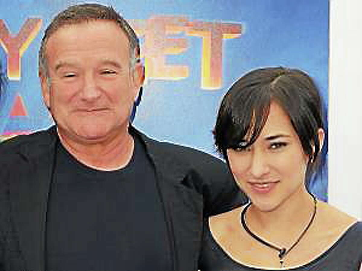 This Nov. 13, 2011, file photo shows actor Robin Williams, left, and his daughter, Zelda at the premiere of “Happy Feet Two” in Los Angeles.