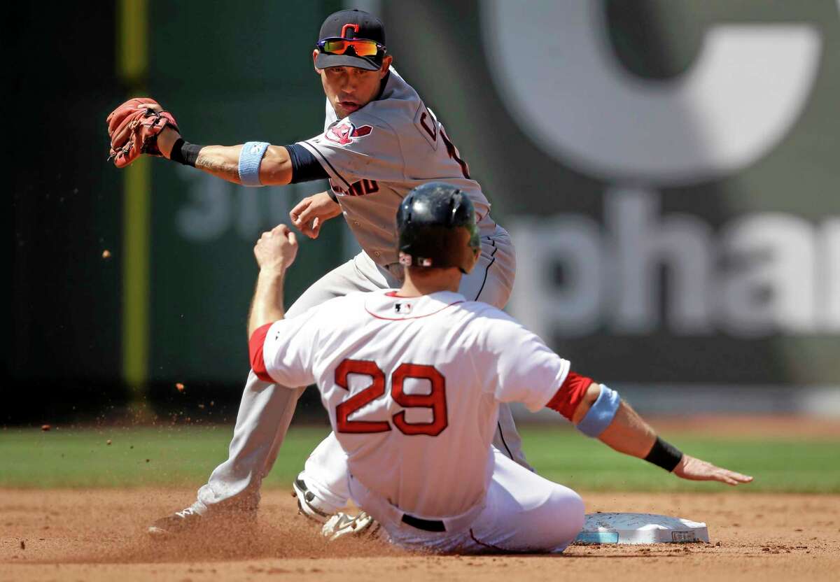 The Red Sox’s Daniel Nava (29) is out on a steal attempt as Indians shortstop Asdrubal Cabrera, top, tags him in the fourth inning on Sunday.