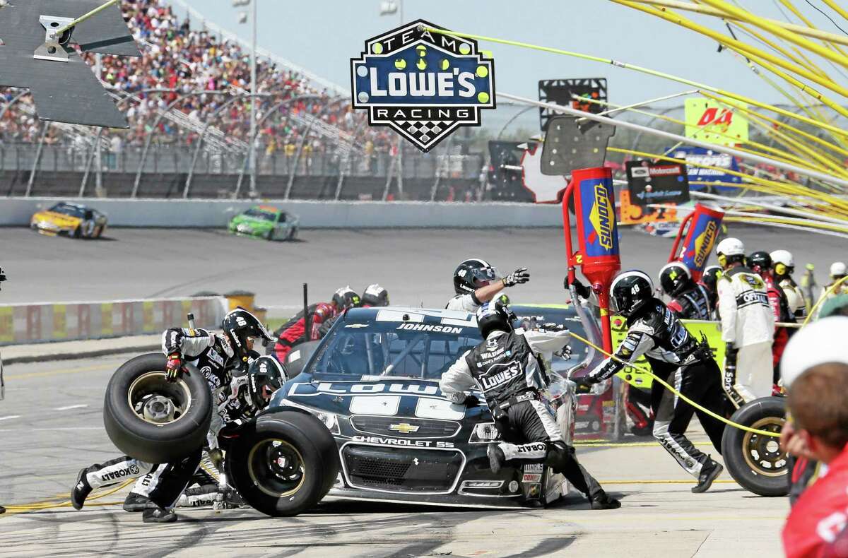 Jimmie Johnson makes a pit stop during the NASCAR Quicken Loans 400 at Michigan International Speedway on Sunday.