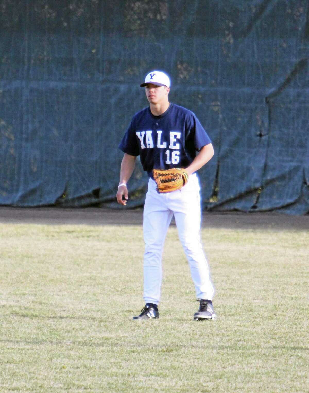 Yale’s Charles Cook pulling the football/baseball double play
